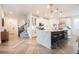 Stunning kitchen with a large center island, quartz countertops, stainless steel appliances and wood look floors at 4707 Pink Jasper Ct, Las Vegas, NV 89141