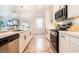 Modern kitchen with stainless steel appliances, quartz counters, and a large island with barstool seating at 4707 Pink Jasper Ct, Las Vegas, NV 89141