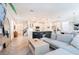 Bright, open-concept living room and kitchen with modern finishes and hardwood floors at 4707 Pink Jasper Ct, Las Vegas, NV 89141
