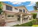 The backyard features a covered patio and mature landscaping for relaxed outdoor living and entertaining at 5148 Forest Oaks Dr, Las Vegas, NV 89149