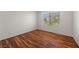 Spacious bedroom with wood-look floors, a large window, and neutral walls at 5148 Forest Oaks Dr, Las Vegas, NV 89149