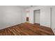 Bedroom with wood floors, closet, and door to the bath at 5148 Forest Oaks Dr, Las Vegas, NV 89149