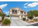 Charming two-story home with a tile roof, well-manicured landscaping, and an attached two-car garage at 5148 Forest Oaks Dr, Las Vegas, NV 89149