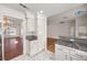 Modern kitchen with granite countertops, white cabinets, stainless appliances, and an open floorplan at 5148 Forest Oaks Dr, Las Vegas, NV 89149