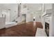 Bright, open living room with wood floors, fireplace, high ceilings and stairway to the 2nd floor at 5148 Forest Oaks Dr, Las Vegas, NV 89149