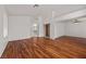 Large primary bedroom with wood floors and ensuite bath at 5148 Forest Oaks Dr, Las Vegas, NV 89149