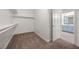 Spacious walk-in closet with built-in shelving and access to the bathroom at 5148 Forest Oaks Dr, Las Vegas, NV 89149