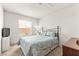 Comfortable bedroom with natural light, soft carpet and blue floral bedding at 5224 Dana Springs Way, Las Vegas, NV 89130