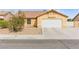 Single-story home featuring a two-car garage and low-maintenance landscaping at 5224 Dana Springs Way, Las Vegas, NV 89130