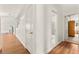 Hallway with light hardwood floors featuring a bedroom and bathroom at 5224 Dana Springs Way, Las Vegas, NV 89130