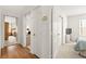 Hallway showcasing access to various rooms with well-lit interior and neutral color scheme, enhancing a sense of flow at 5224 Dana Springs Way, Las Vegas, NV 89130