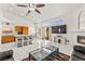 Open floor plan showcases the living room, kitchen with breakfast bar, and bright windows at 5224 Dana Springs Way, Las Vegas, NV 89130