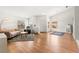 Bright living room with hardwood floors and large windows that bring in natural light at 5224 Dana Springs Way, Las Vegas, NV 89130