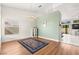 Spacious living room with hardwood floors, large window, and elegant chandelier creating a bright and inviting atmosphere at 5224 Dana Springs Way, Las Vegas, NV 89130