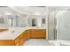 Bright bathroom featuring a double sink vanity and glass shower enclosure at 5224 Dana Springs Way, Las Vegas, NV 89130