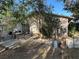 Private backyard featuring an outdoor dining area, mature trees, and a grill perfect for outdoor gatherings at 5352 Eugene Ave, Las Vegas, NV 89108