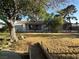 Expansive backyard featuring mature trees, a covered patio, and plenty of room for outdoor activities at 5352 Eugene Ave, Las Vegas, NV 89108