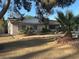 Well-maintained single-story home featuring desert landscaping, mature palm trees, and a charming front yard at 5352 Eugene Ave, Las Vegas, NV 89108