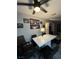 A dining area features a modern marble-top table, black chairs, and decorative wall art at 5365 Shake Ct # 103, Las Vegas, NV 89122