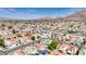 Scenic view of a residential area highlighting the mix of homes, green foliage, and skyline with mountains at 5853 Calobar Ln, Las Vegas, NV 89110