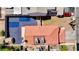 Top down shot of a backyard with desert landscaping and a home with a red tiled roof at 5853 Calobar Ln, Las Vegas, NV 89110