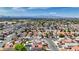 Broad perspective showcases diverse houses with colorful roofs, lush trees, and clear skyline at 5853 Calobar Ln, Las Vegas, NV 89110
