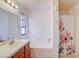 Bathroom featuring a tub/shower combo and wood cabinets at 5853 Calobar Ln, Las Vegas, NV 89110