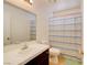 Bathroom featuring tile floors, a single sink vanity, and a shower with a curtain at 5853 Calobar Ln, Las Vegas, NV 89110