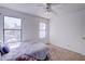Bright bedroom featuring carpeted floors and two windows for natural light at 5853 Calobar Ln, Las Vegas, NV 89110