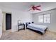 Bedroom featuring carpeted floors and a window for natural light at 5853 Calobar Ln, Las Vegas, NV 89110