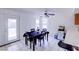 Bright dining area with tile floors, a ceiling fan, and a dining room table set at 5853 Calobar Ln, Las Vegas, NV 89110