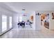 Bright dining area with tile floors, a ceiling fan and direct access to the kitchen at 5853 Calobar Ln, Las Vegas, NV 89110