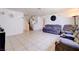 Spacious living room features neutral walls, tile flooring, and stairway access at 5853 Calobar Ln, Las Vegas, NV 89110