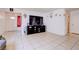 Open-concept living area with neutral tile, decor, and views of entry and adjacent room at 5853 Calobar Ln, Las Vegas, NV 89110