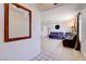 Bright living room with tile flooring, neutral paint, and view to adjacent rooms at 5853 Calobar Ln, Las Vegas, NV 89110