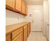 Utility space featuring ample storage with built-in shelving and cabinets above at 5853 Calobar Ln, Las Vegas, NV 89110