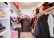 Walk-in closet with built-in shelving and hanging rods at 5853 Calobar Ln, Las Vegas, NV 89110