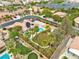 This stunning aerial view showcases a private backyard, a sparkling pool, mature landscaping and a playground at 5889 Taylor Valley Ave, Las Vegas, NV 89131