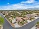 An aerial view showcases a single-story home with a pool and desert landscaping at 5889 Taylor Valley Ave, Las Vegas, NV 89131