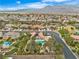 Picturesque aerial shot showcasing homes with pools, mature trees, and a well-planned community layout at 5889 Taylor Valley Ave, Las Vegas, NV 89131