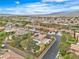 Neighborhood aerial view featuring lush greenery, sidewalks, desert landscaping, and open space for walking at 5889 Taylor Valley Ave, Las Vegas, NV 89131