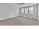 Large bonus room with neutral colors, plush carpet, and great natural light at 5889 Taylor Valley Ave, Las Vegas, NV 89131