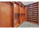 Spacious walk-in closet with custom wood shelving and carpet flooring at 5889 Taylor Valley Ave, Las Vegas, NV 89131
