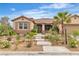 Charming single-story home with a tile roof, beautiful desert landscaping and a welcoming front entrance at 5889 Taylor Valley Ave, Las Vegas, NV 89131