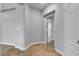This hallway shows travertine floors with access to multiple rooms at 5889 Taylor Valley Ave, Las Vegas, NV 89131