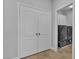 This laundry room features travertine tile and modern washer and dryer units at 5889 Taylor Valley Ave, Las Vegas, NV 89131