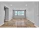 Bright living room with tile flooring and three windows offering natural light at 5889 Taylor Valley Ave, Las Vegas, NV 89131