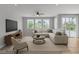 Stylishly furnished living room with comfortable seating, neutral colors and a TV at 5889 Taylor Valley Ave, Las Vegas, NV 89131