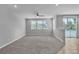 Spacious living room featuring plush carpeting, neutral walls, and large windows at 5889 Taylor Valley Ave, Las Vegas, NV 89131