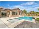 Relax in style with this pristine pool featuring a tanning deck and easy access to the house and solar panels at 5889 Taylor Valley Ave, Las Vegas, NV 89131